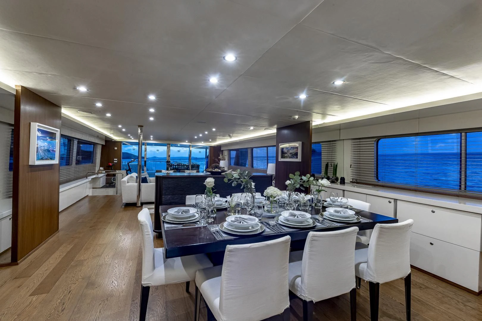 a large dining room with a large table and chairs aboard KARTAL YUVASI Yacht for Charter