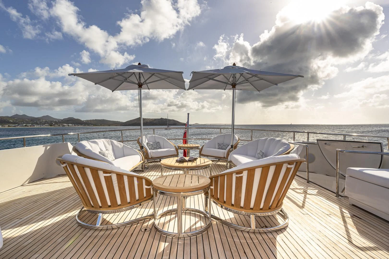 a table and chairs on a deck aboard KARTAL YUVASI Yacht for Charter
