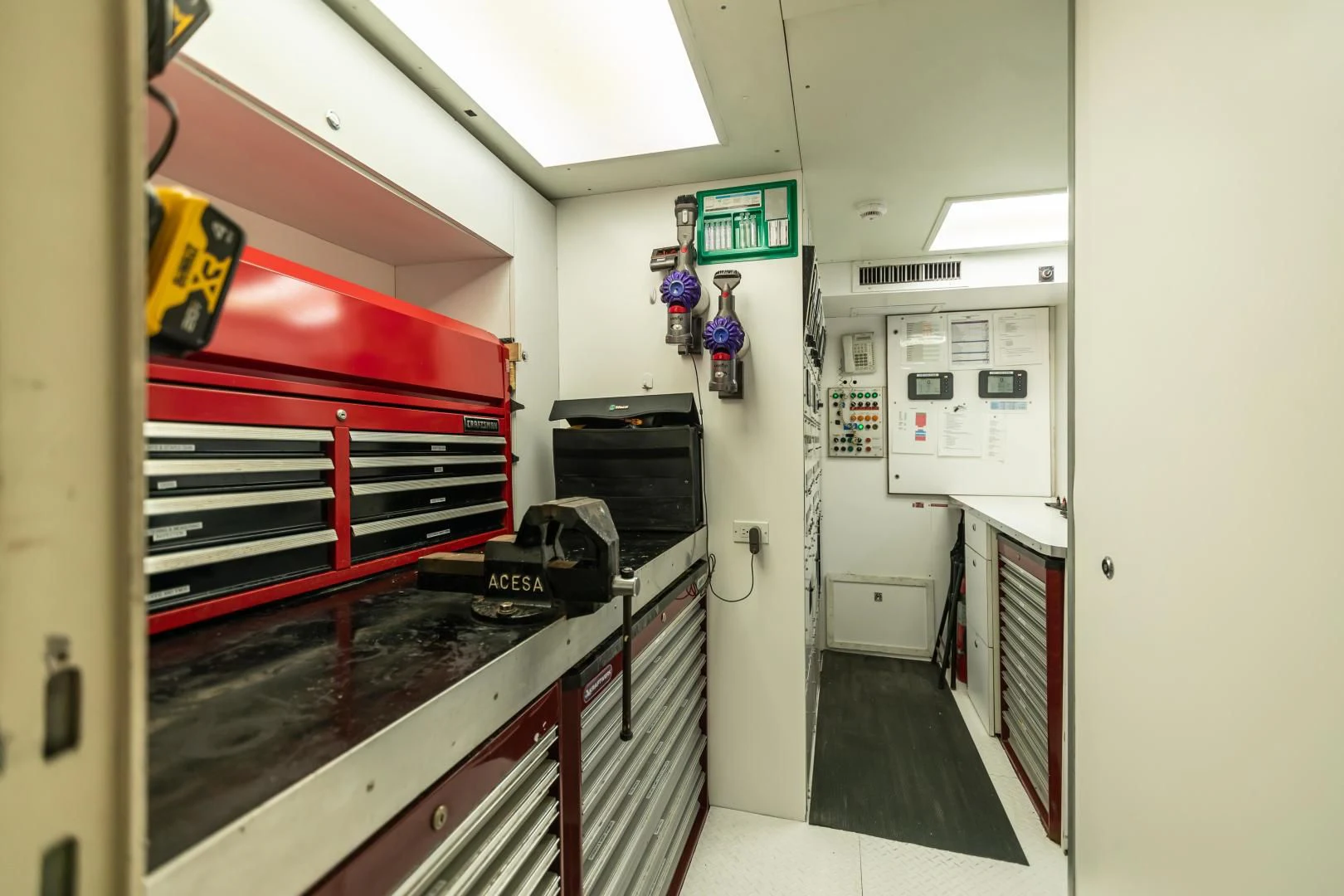 a kitchen with a red and white oven and a large red stove aboard KARTAL YUVASI Yacht for Charter
