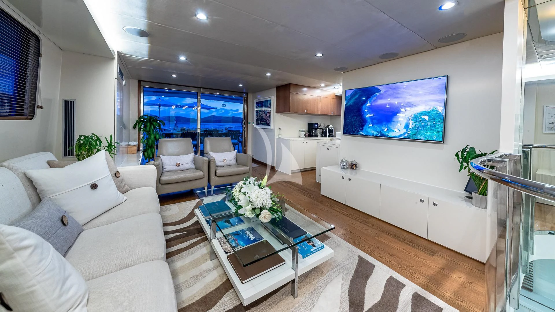 a living room with a large window aboard KARTAL YUVASI Yacht for Charter