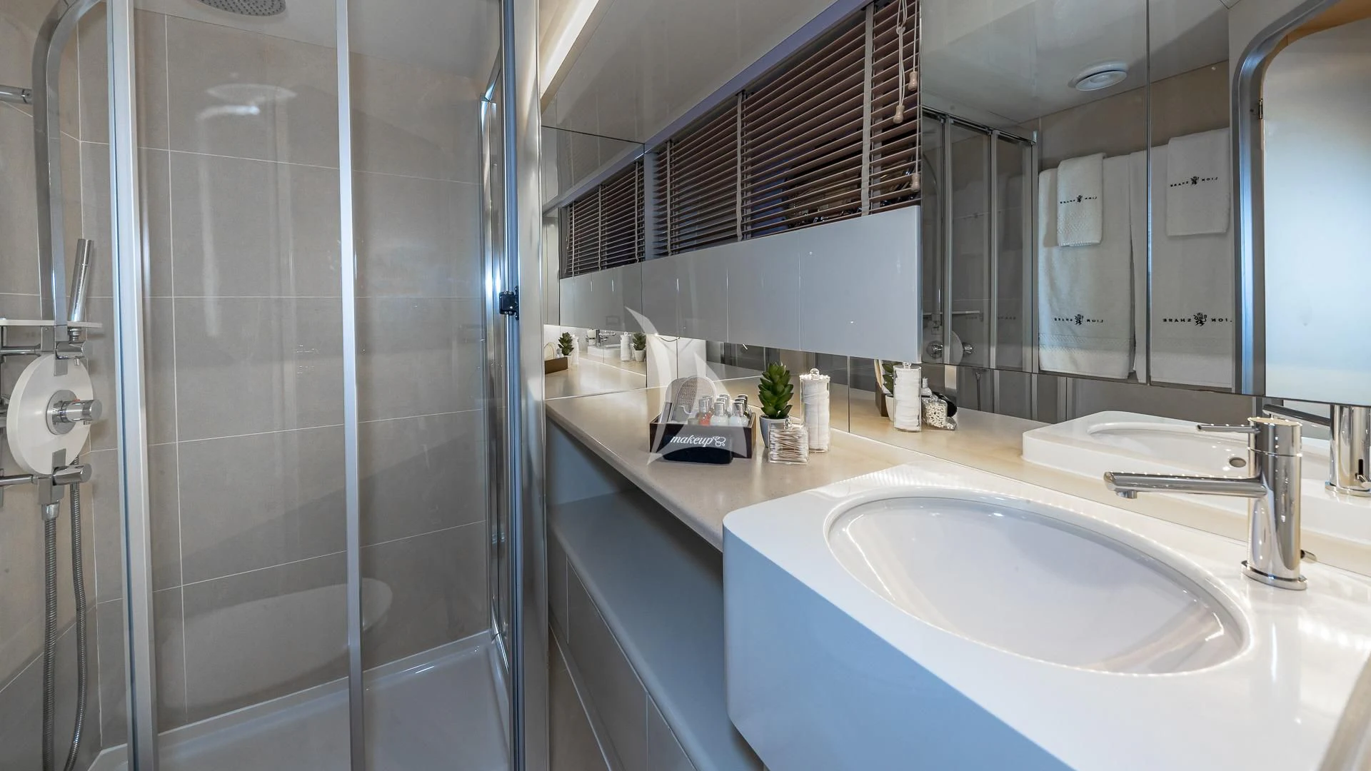 a bathroom with a glass shower aboard KARTAL YUVASI Yacht for Charter