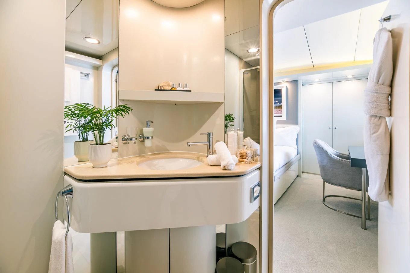 a bathroom with a sink and a chair aboard KARTAL YUVASI Yacht for Charter