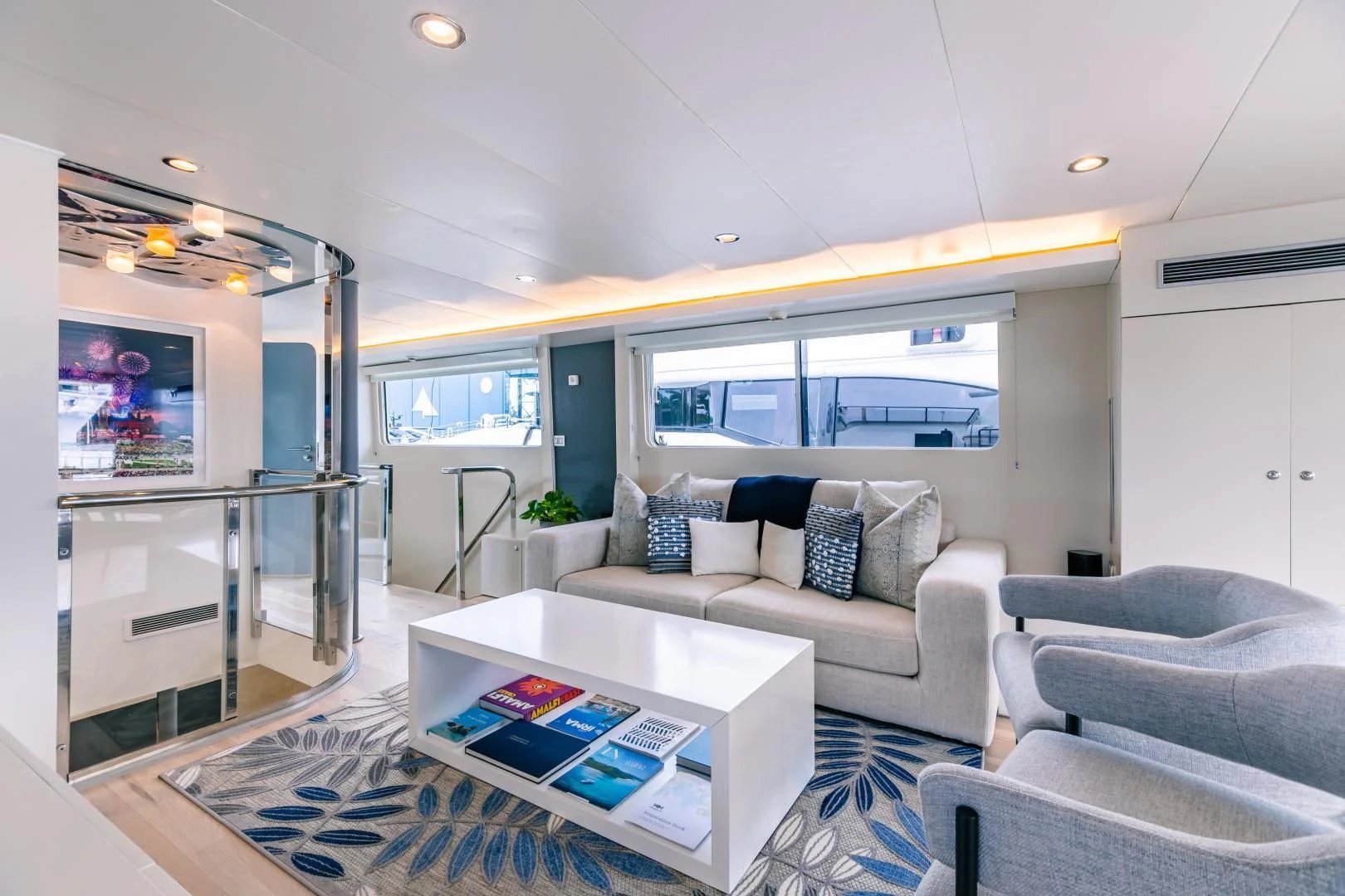 a living room with a large glass door aboard KARTAL YUVASI Yacht for Charter