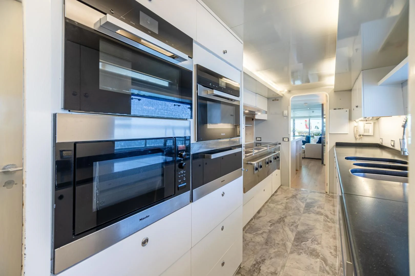 a kitchen with stainless steel appliances aboard KARTAL YUVASI Yacht for Charter