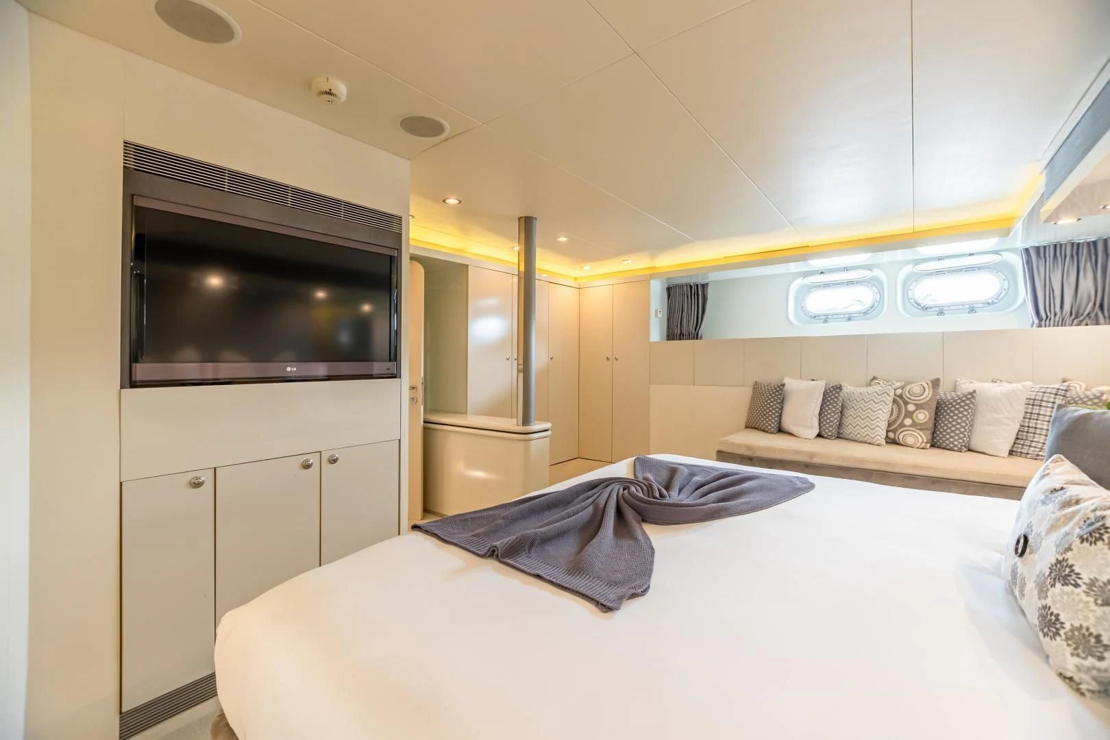 a room with a bed and a tv aboard KARTAL YUVASI Yacht for Charter