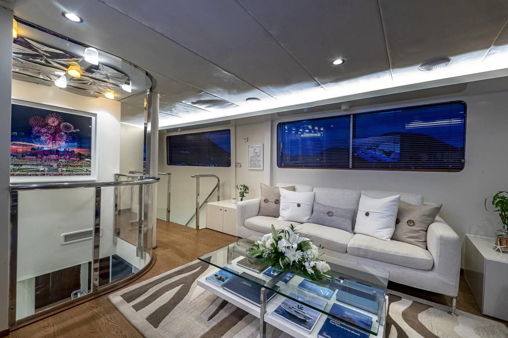 a living room with a large screen aboard KARTAL YUVASI Yacht for Charter