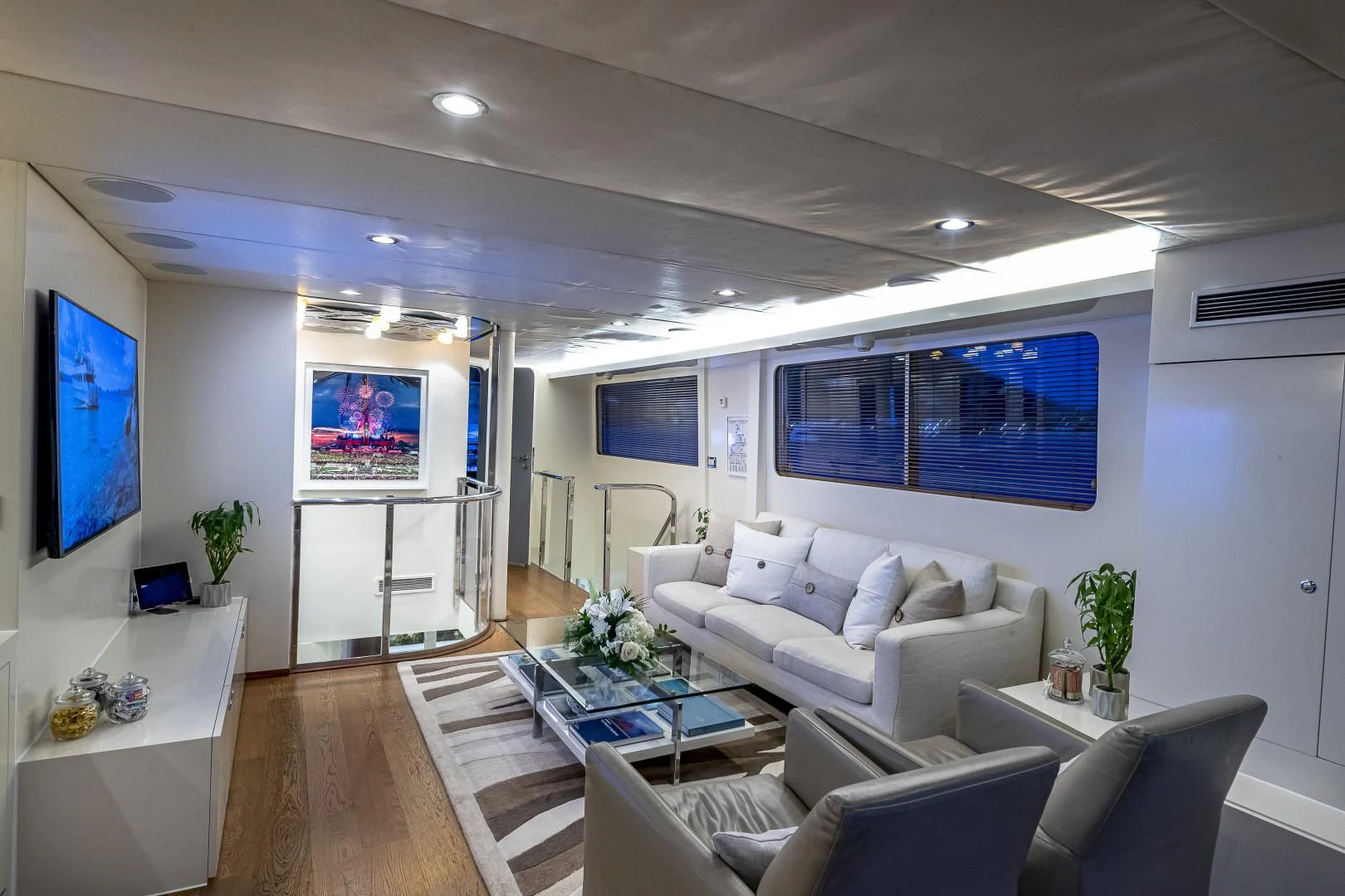 a living room with a large screen aboard KARTAL YUVASI Yacht for Charter