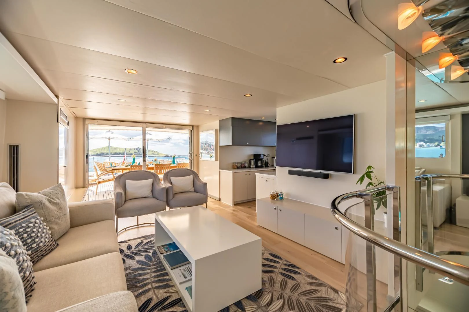 a living room with a glass table aboard KARTAL YUVASI Yacht for Charter