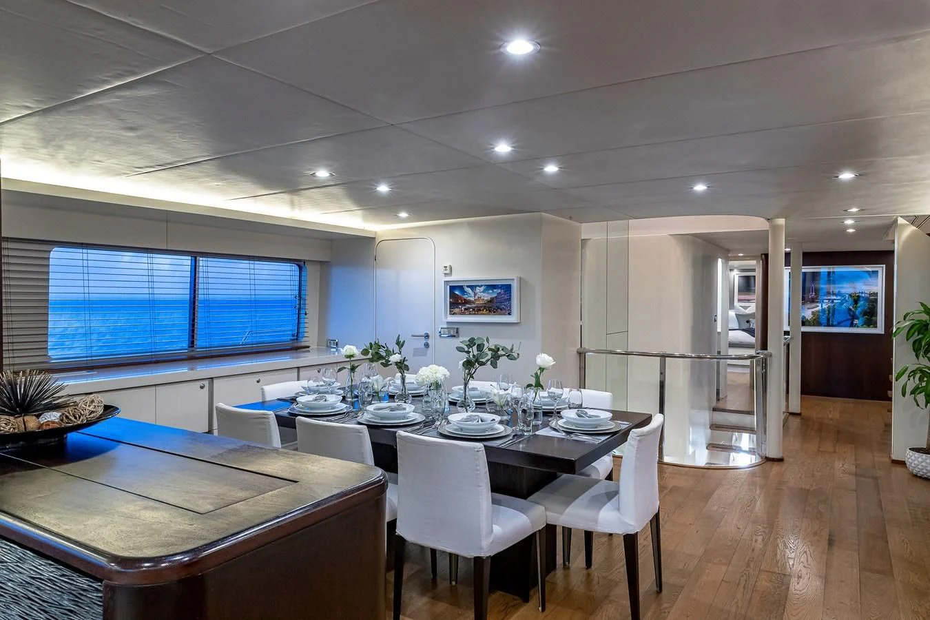 a room with tables and chairs aboard KARTAL YUVASI Yacht for Charter