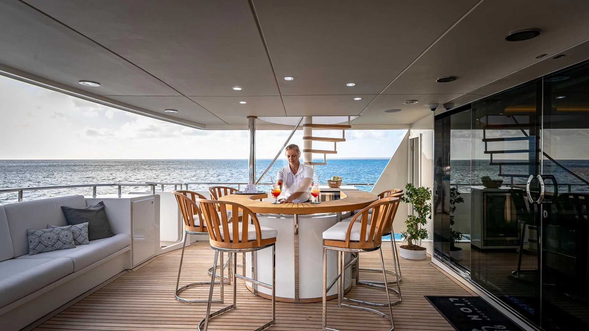 a person sitting at a table aboard KARTAL YUVASI Yacht for Charter