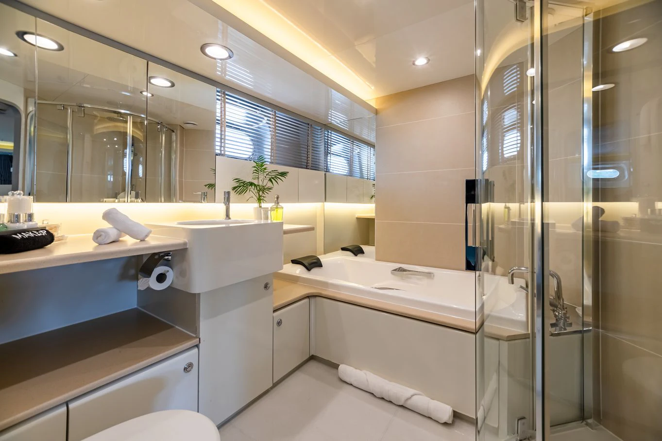 a bathroom with a glass shower aboard KARTAL YUVASI Yacht for Charter