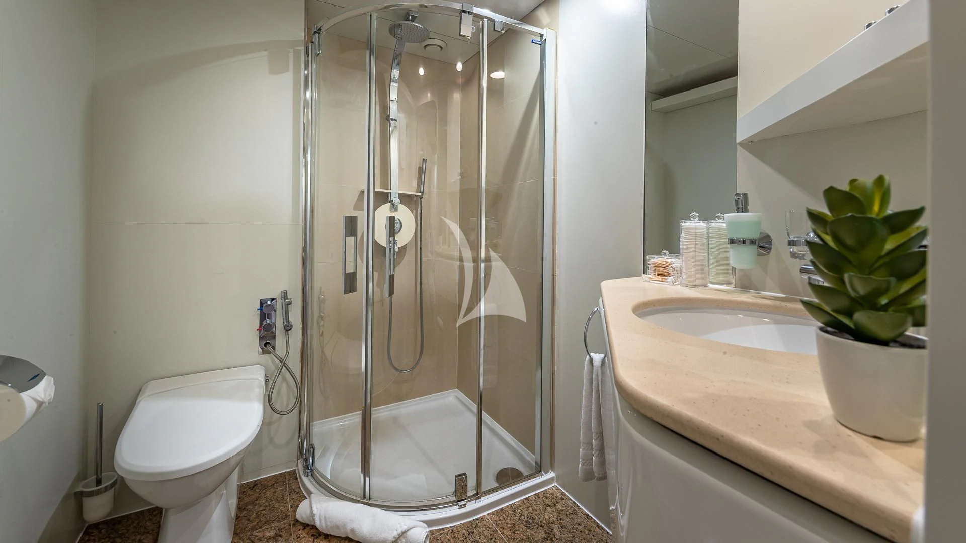 a bathroom with a glass shower aboard KARTAL YUVASI Yacht for Charter