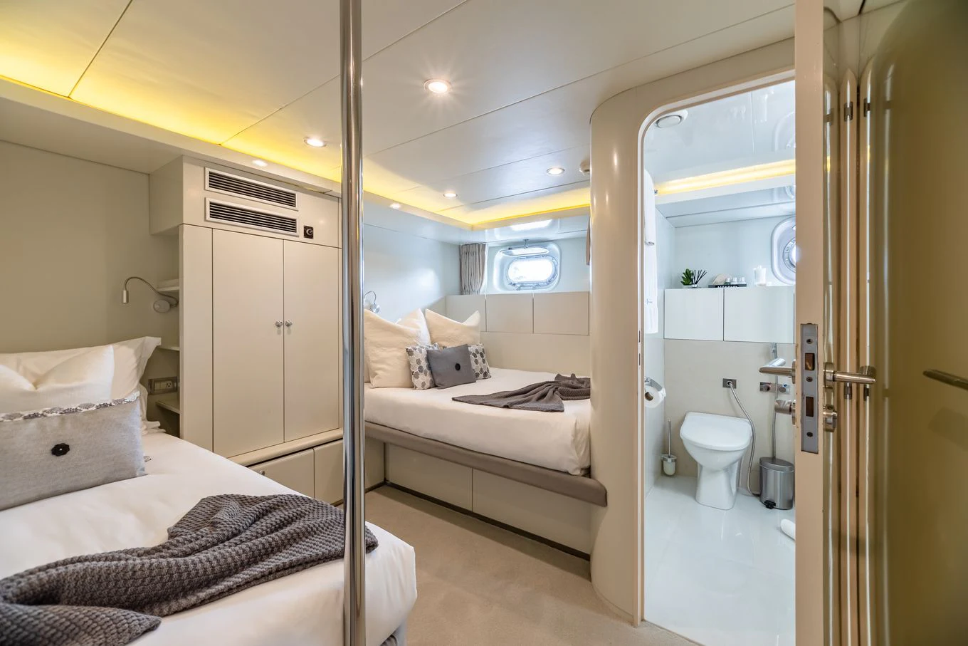 a bathroom with a bed and a mirror aboard KARTAL YUVASI Yacht for Charter