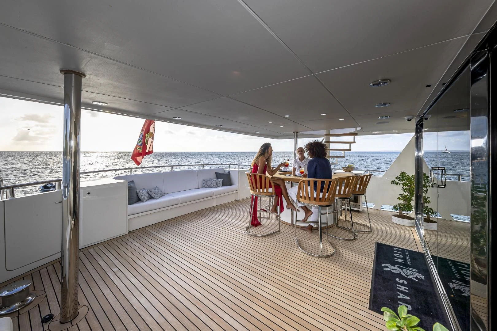 a group of people sitting at a table on a boat aboard KARTAL YUVASI Yacht for Charter