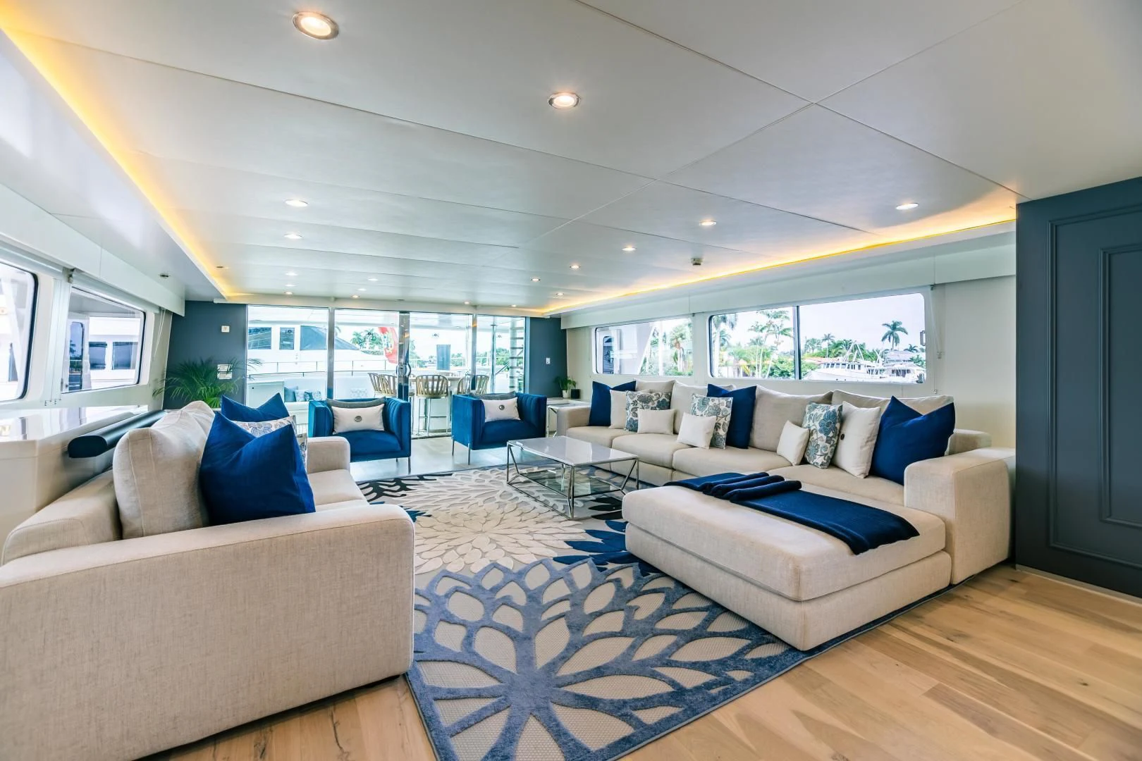 a living room with a blue rug aboard KARTAL YUVASI Yacht for Charter