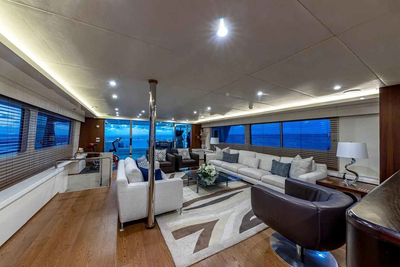 a living room with a large window aboard KARTAL YUVASI Yacht for Charter