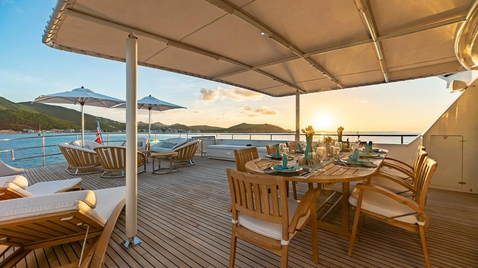 a patio with tables and chairs aboard KARTAL YUVASI Yacht for Charter