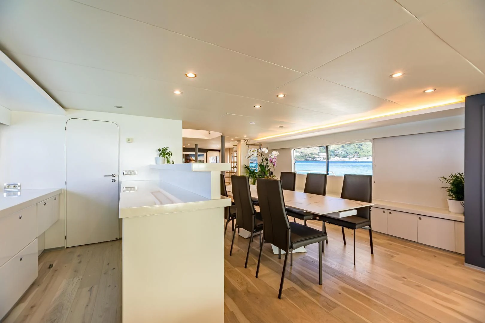 a kitchen and dining area aboard KARTAL YUVASI Yacht for Charter