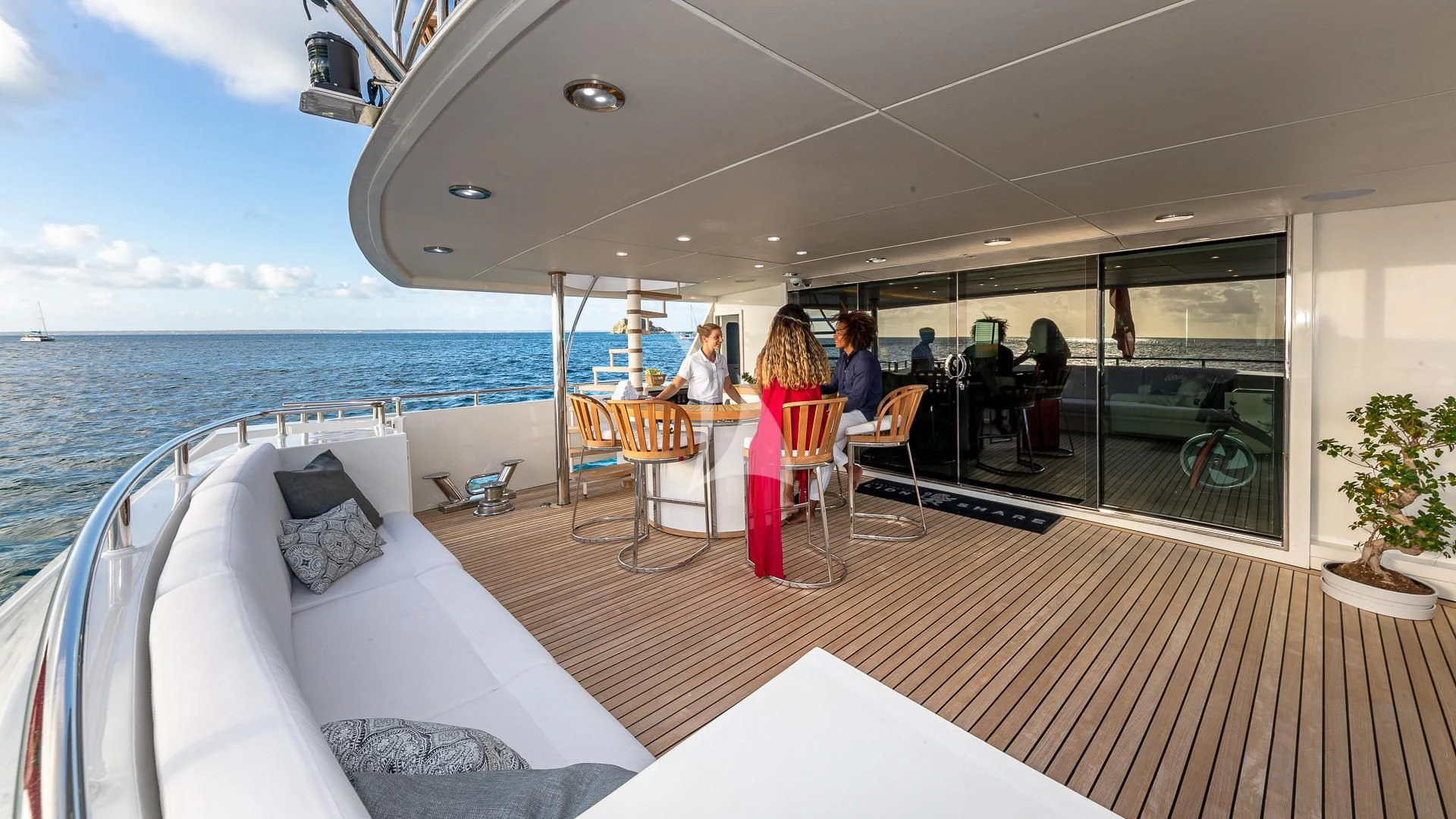 a boat with a group of people sitting at a table aboard KARTAL YUVASI Yacht for Charter
