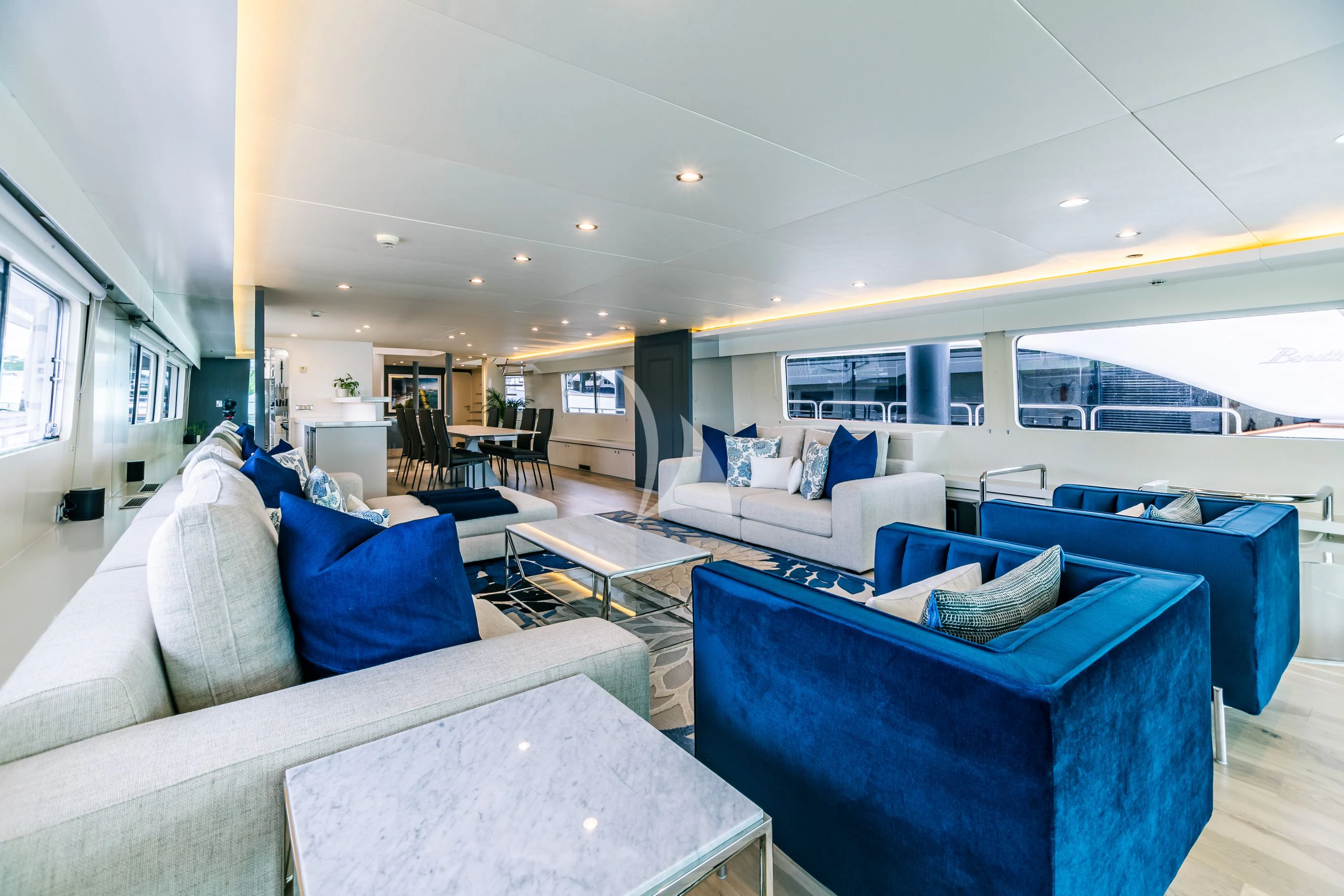 a living room with a large window aboard KARTAL YUVASI Yacht for Charter