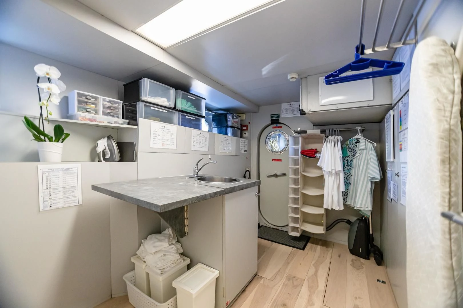 a room with a sink and washer and dryer aboard KARTAL YUVASI Yacht for Charter