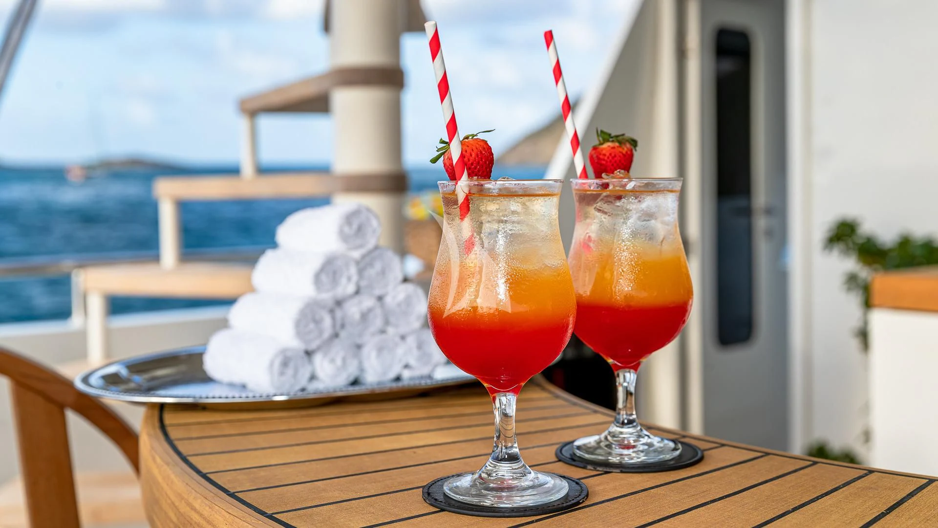 a group of glasses with drinks on a table aboard KARTAL YUVASI Yacht for Charter