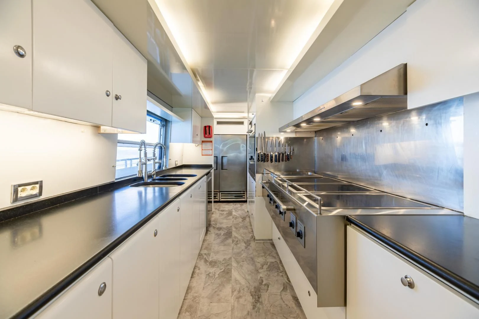 a kitchen with stainless steel appliances aboard KARTAL YUVASI Yacht for Charter