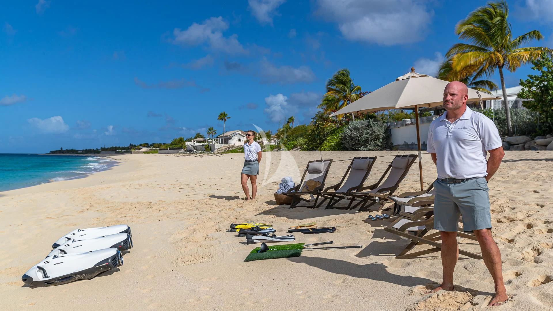 a man standing on a beach aboard KARTAL YUVASI Yacht for Charter