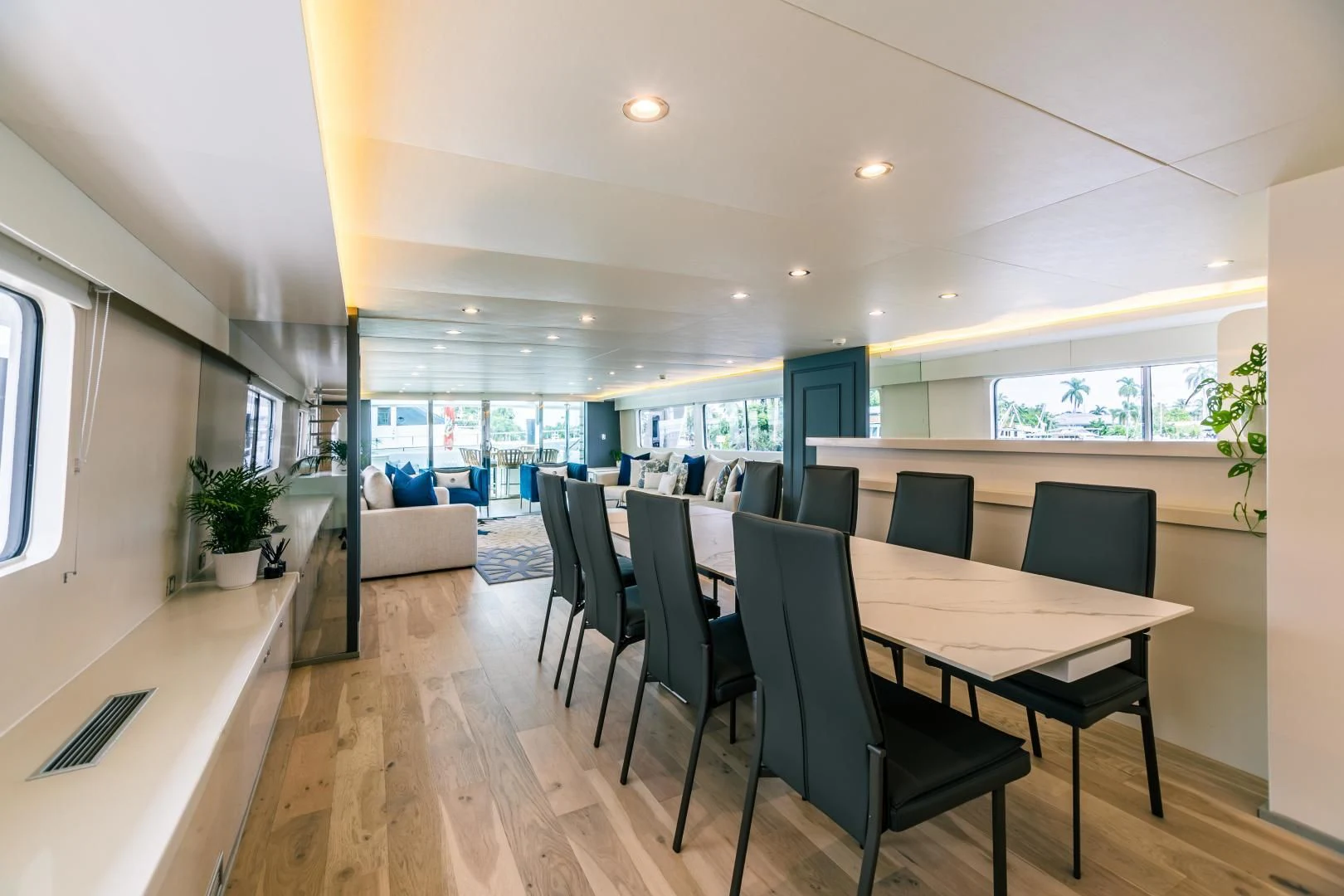 a room with a table chairs and a couch aboard KARTAL YUVASI Yacht for Charter