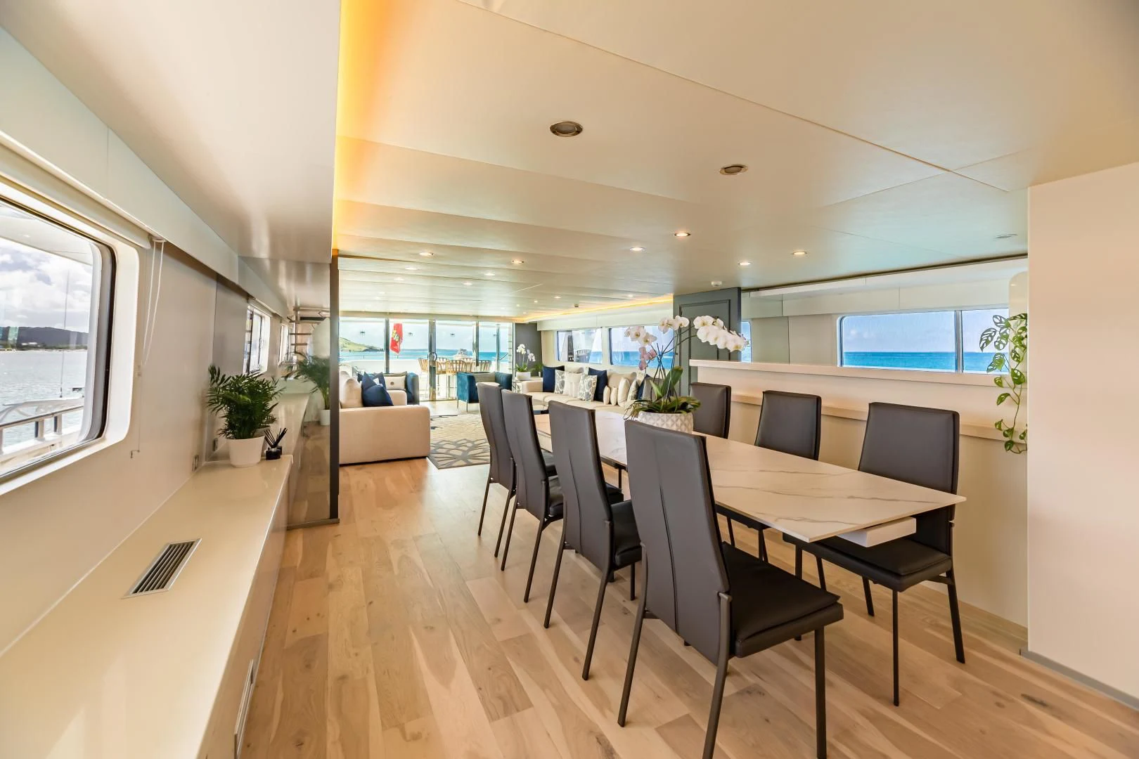 a large room with a table and chairs aboard KARTAL YUVASI Yacht for Charter