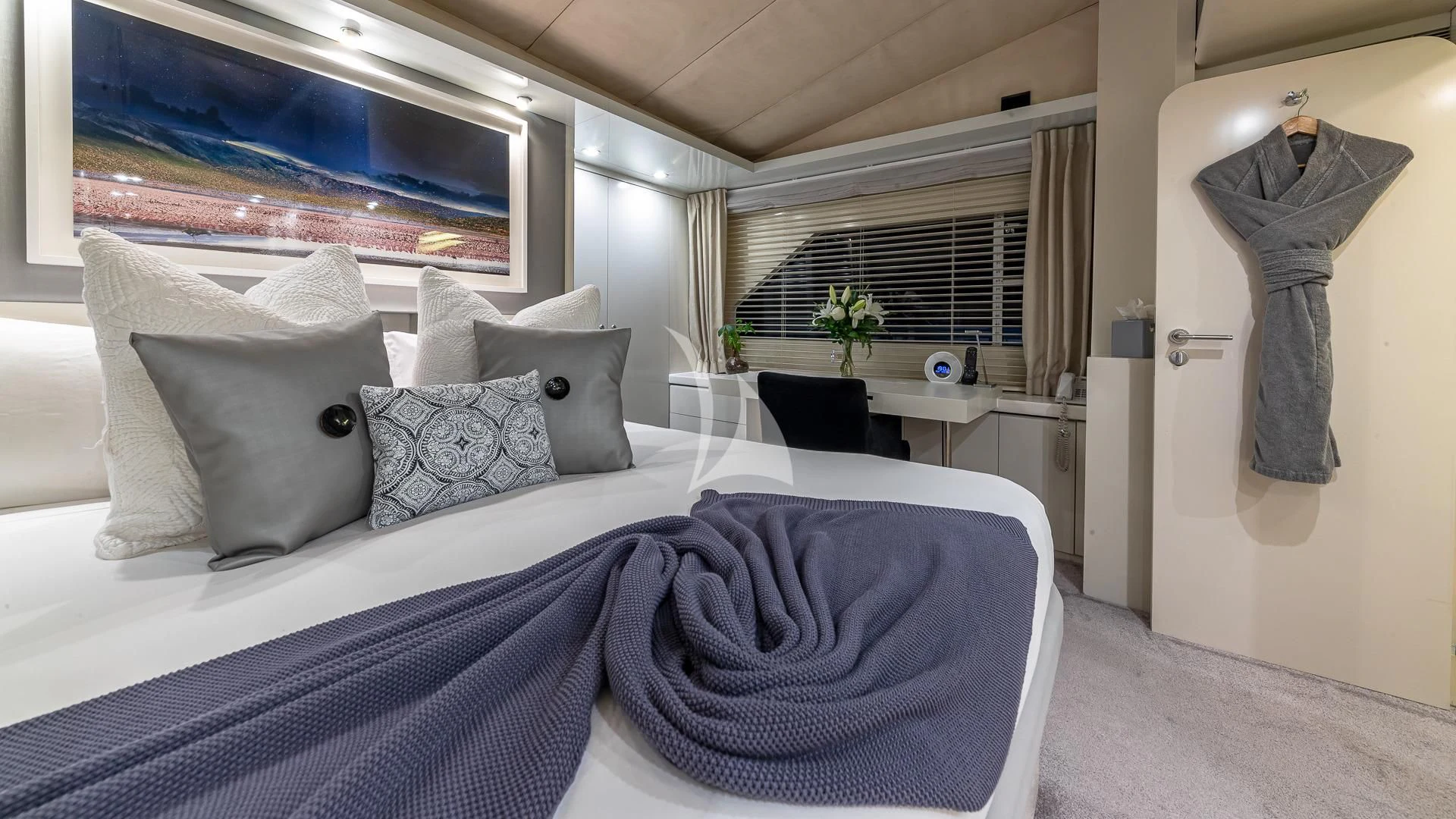 a bed with blue sheets aboard KARTAL YUVASI Yacht for Charter