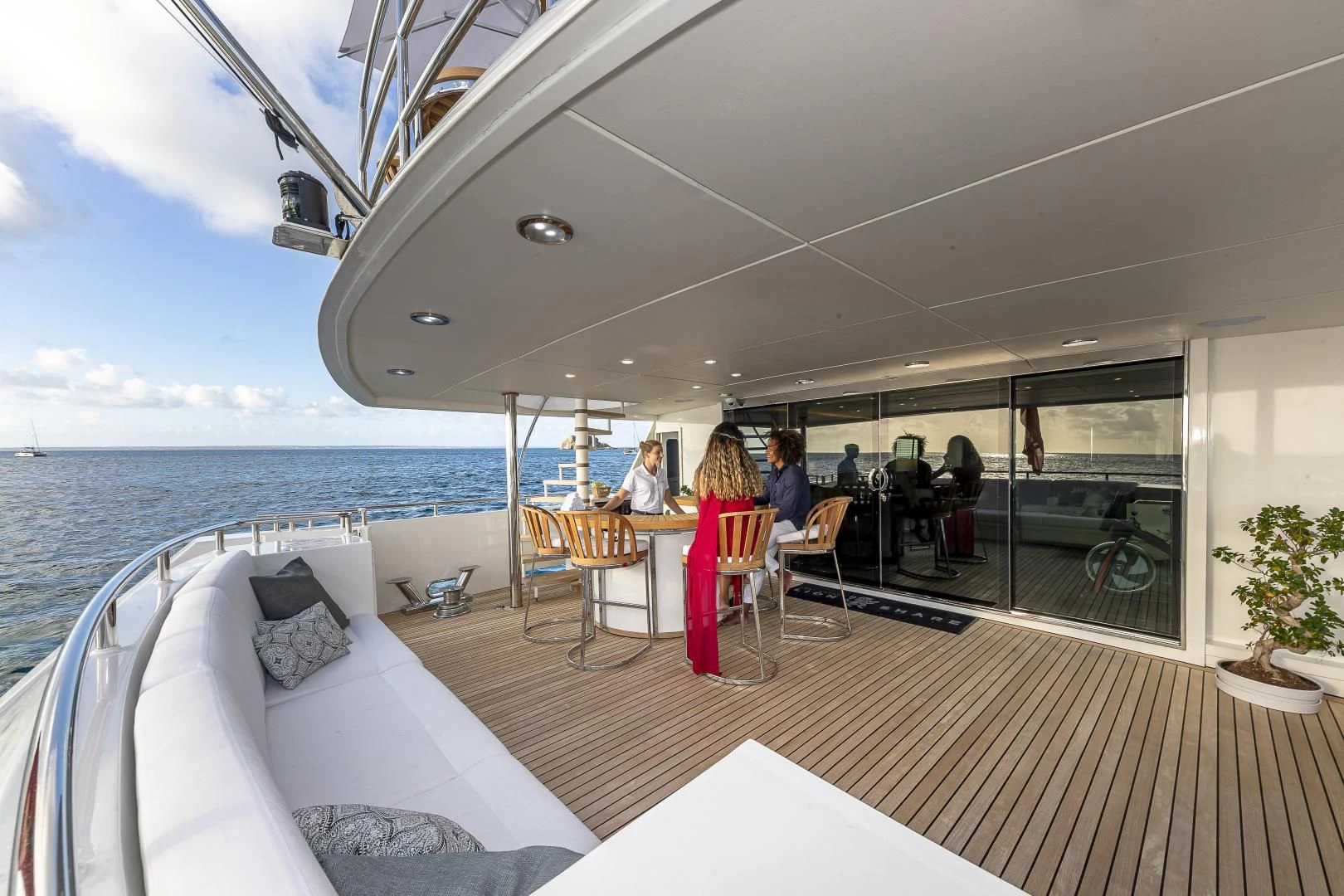 a boat with a table and chairs aboard KARTAL YUVASI Yacht for Charter
