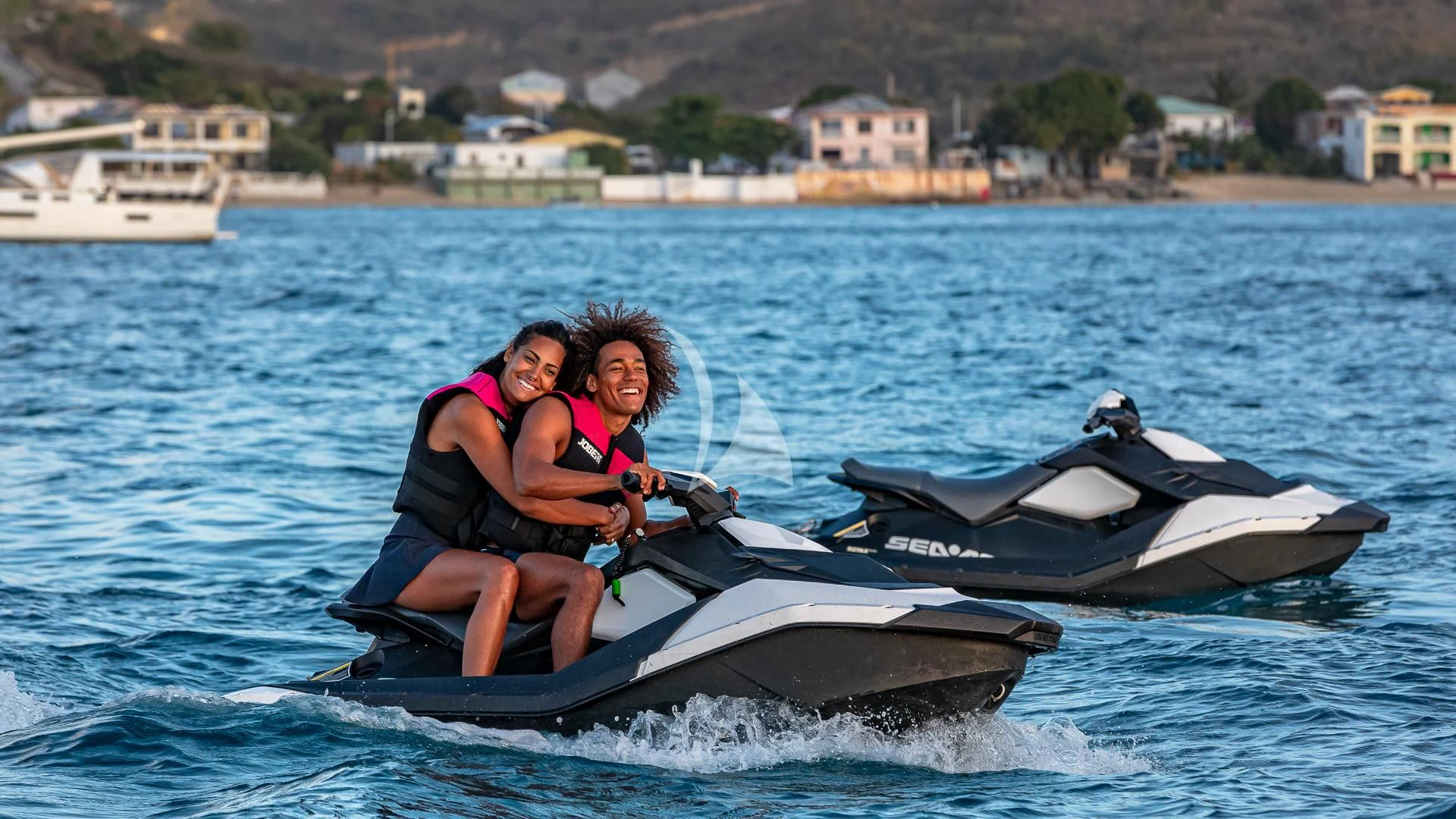 a couple of girls on a jet ski aboard KARTAL YUVASI Yacht for Charter