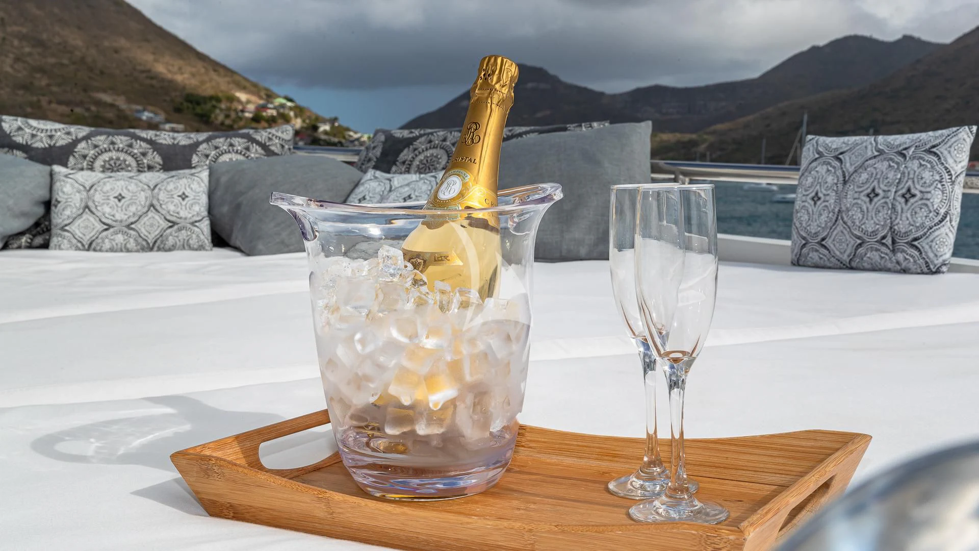 a glass of champagne and a bottle on a table aboard KARTAL YUVASI Yacht for Charter