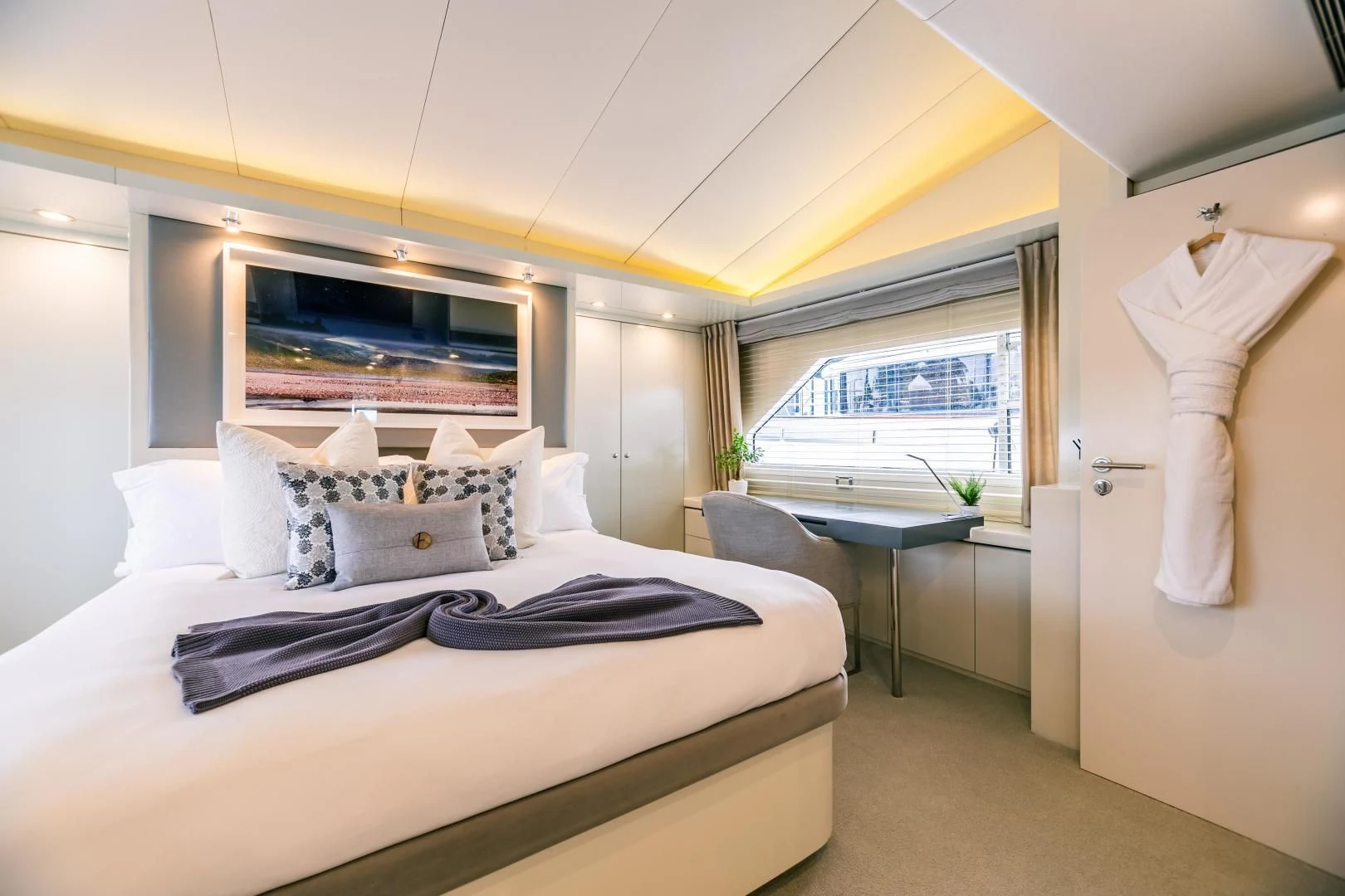 a bedroom with a large bed aboard KARTAL YUVASI Yacht for Charter