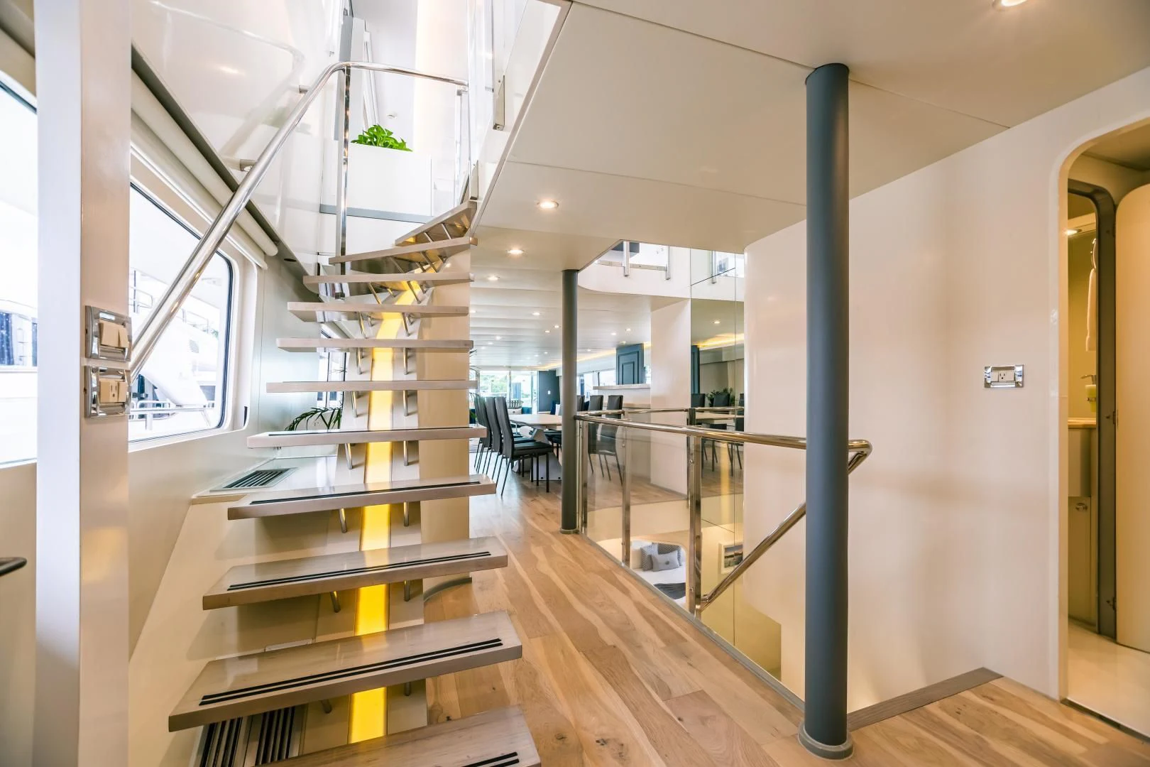 a room with a staircase and a glass wall aboard KARTAL YUVASI Yacht for Charter