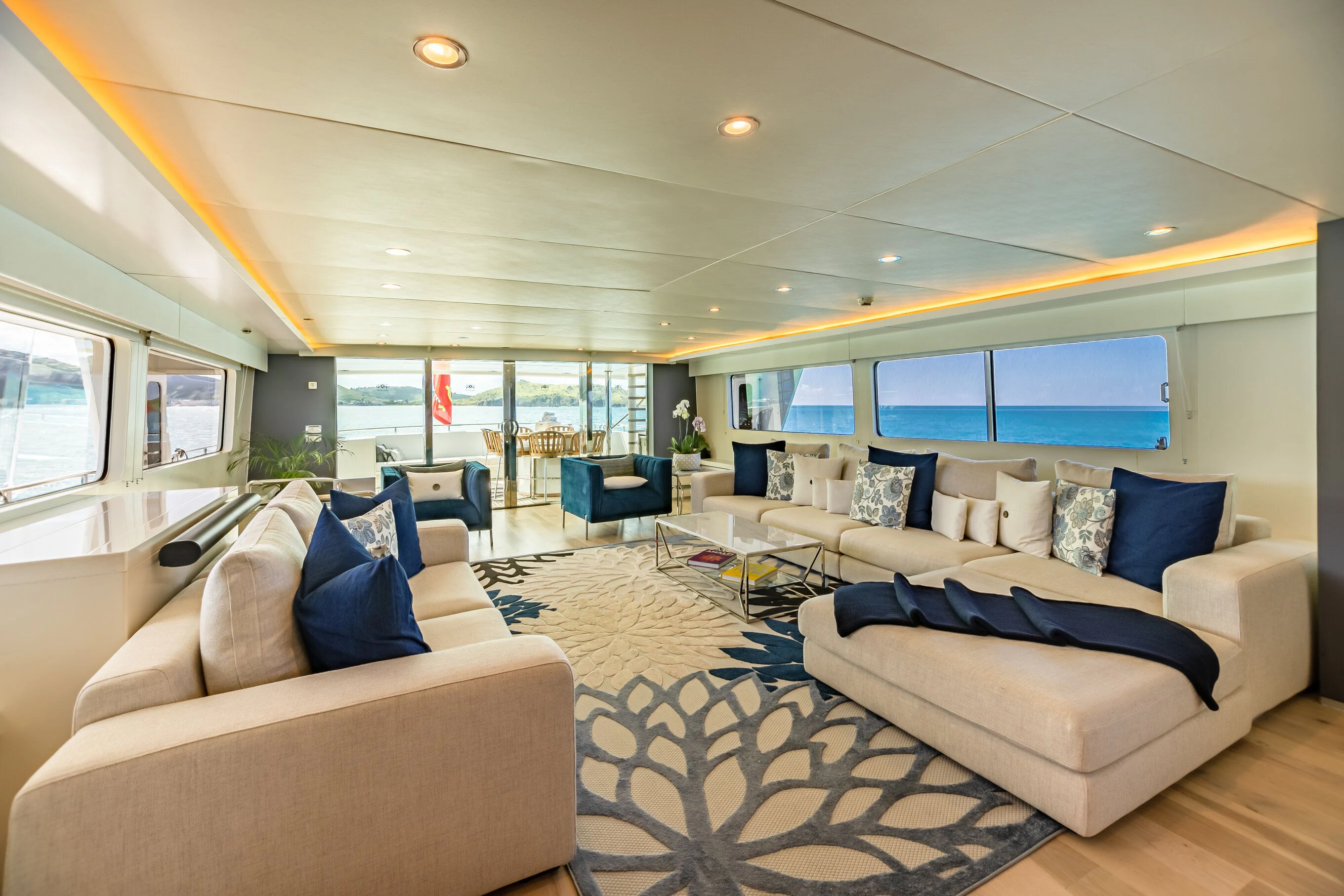a large living room with a large window aboard KARTAL YUVASI Yacht for Charter