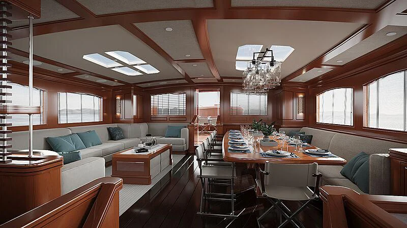 a large living room with a dining table and a couch aboard RAINBOW II Yacht for Sale