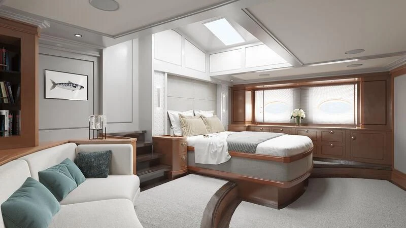 a bedroom with a bed and a couch aboard RAINBOW II Yacht for Sale