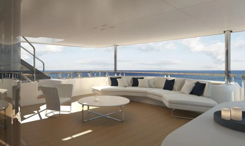 a room with a couch and a table and a large body of water aboard DAWO Yacht for Sale