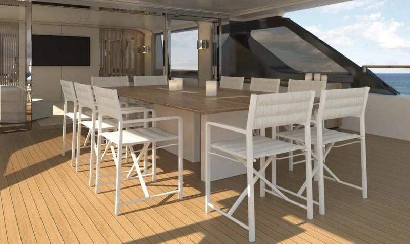 a table and chairs on a deck aboard DAWO Yacht for Sale