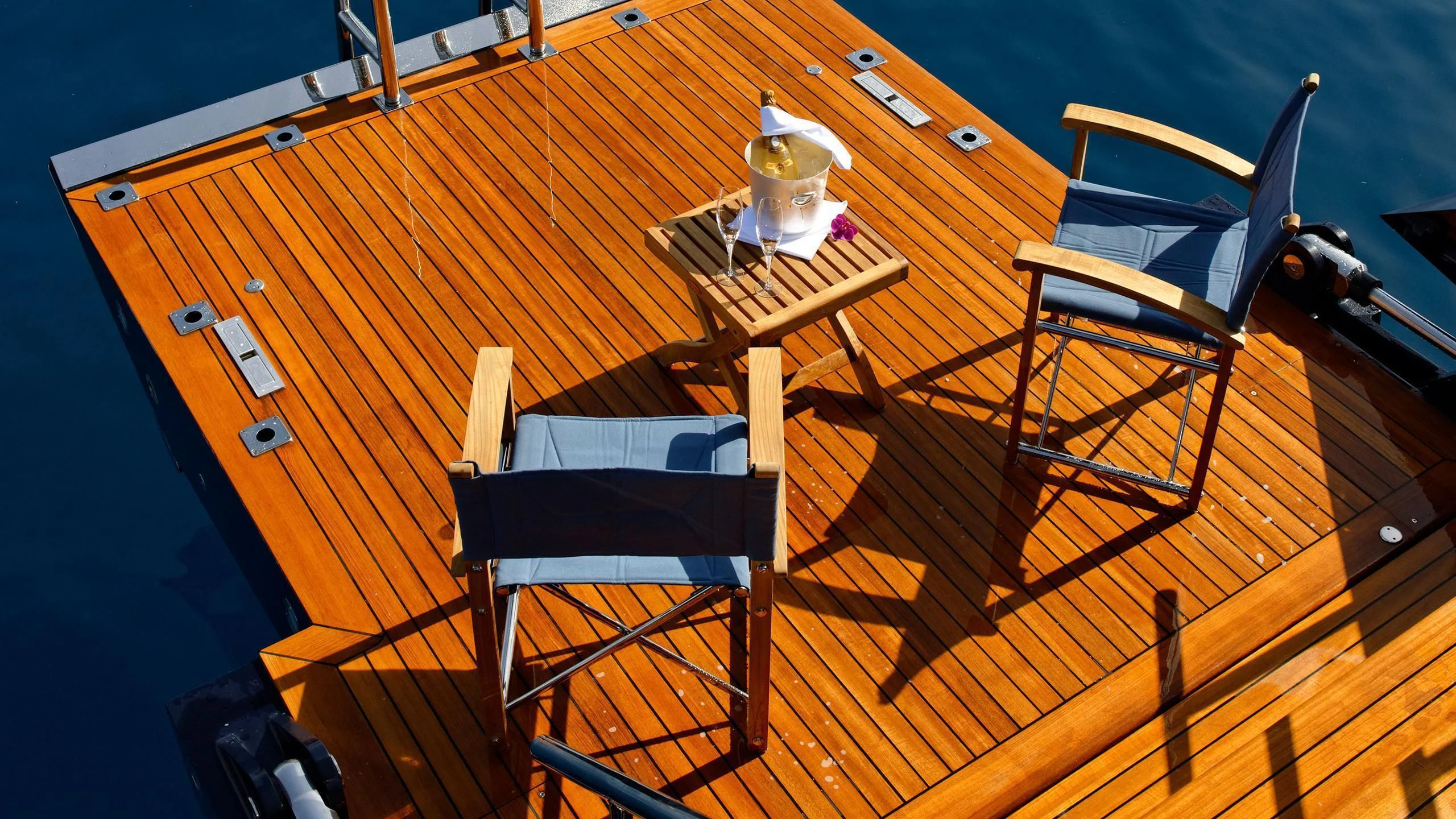 a table and chairs on a deck aboard MELEK Yacht for Sale