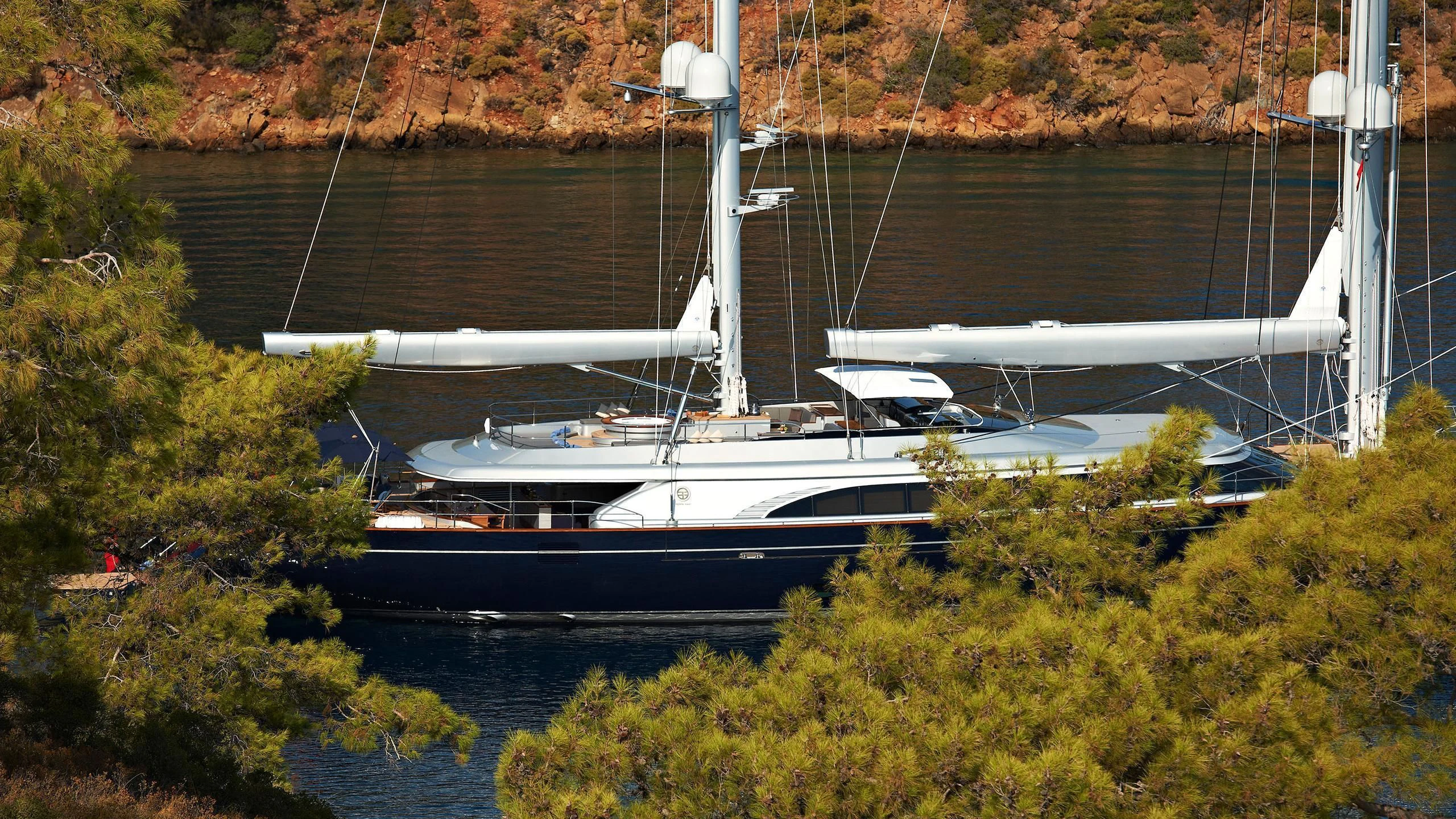 a boat docked in a harbor aboard MELEK Yacht for Sale