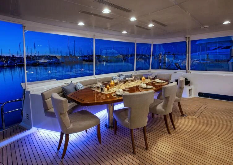 a large dining table with chairs aboard NEW JOURNEY Yacht for Sale