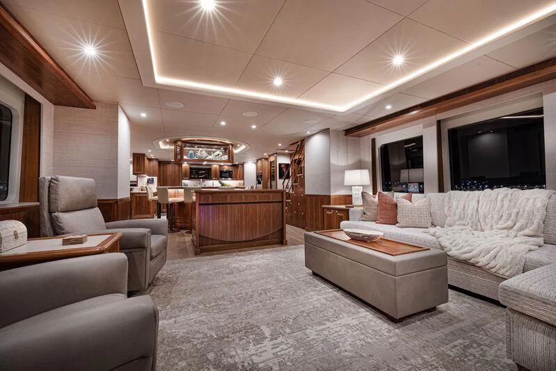 a living room with a large fireplace aboard NEW JOURNEY Yacht for Sale