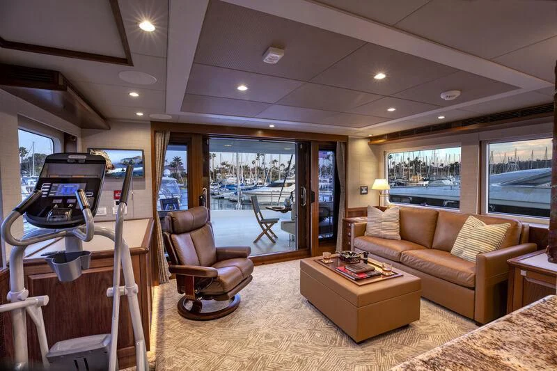 a living room with a large window aboard NEW JOURNEY Yacht for Sale