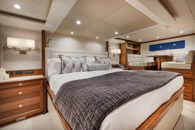 a bedroom with a bed and a desk aboard NEW JOURNEY Yacht for Sale