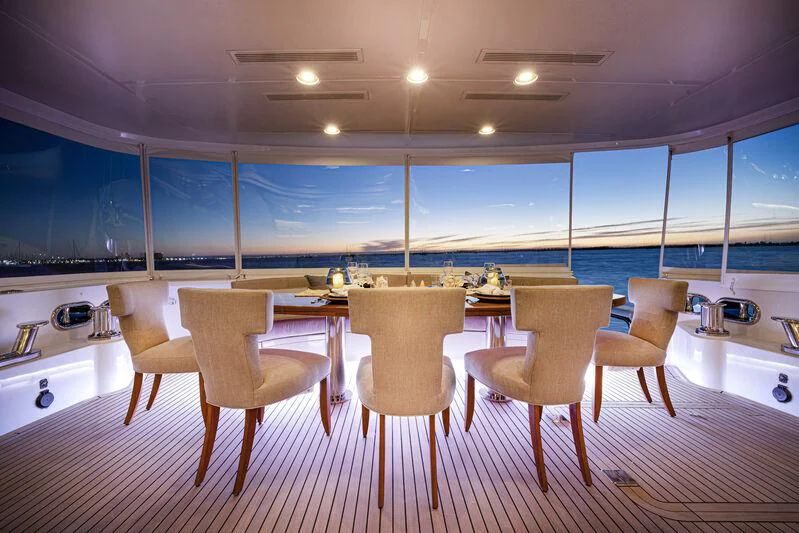 a large kitchen with a table and chairs aboard NEW JOURNEY Yacht for Sale
