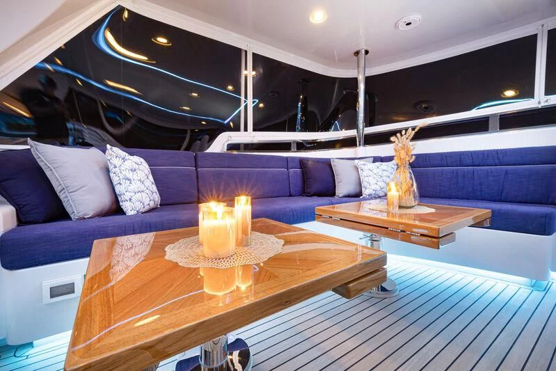 a boat with candles on a table aboard NEW JOURNEY Yacht for Sale