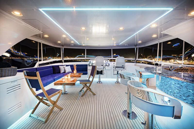 a pool with chairs and tables aboard NEW JOURNEY Yacht for Sale